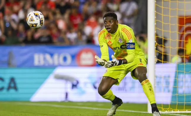 Toronto FC goalkeeper Sean Johnson makes a save during first-half MLS soccer match action against D.C. United in Toronto, Saturday, Aug. 31, 2024. (Christopher Katsarov/The Canadian Press via AP)