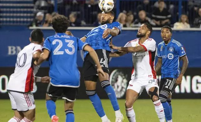 CF Montreal's George Campbell, center, heads the ball during the first half of an MLS soccer match against the San Jose Earthquakes in Montreal, Saturday, September 28, 2024. (Peter McCabe/The Canadian Press via AP)