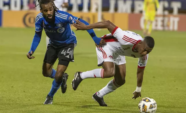 CF Montreal's Raheem Edwards, left, battles with San Jose Earthquakes' Carlos Gruezo during first-half MLS soccer match action in Montreal, Saturday, Sept. 28, 2024. (Peter McCabe/The Canadian Press via AP)