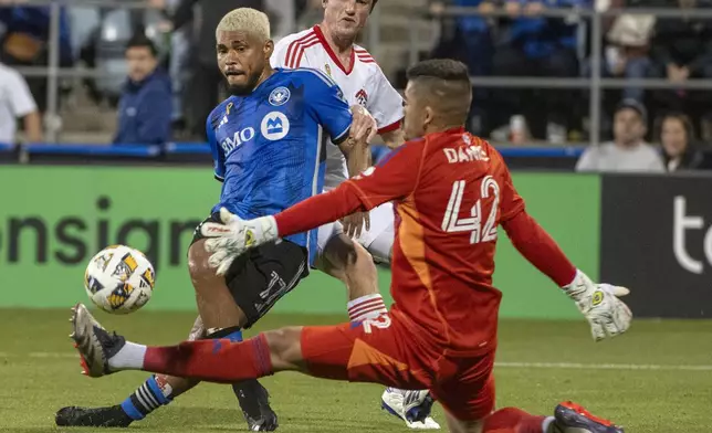 CF Montreal's Josef Martinez, left, takes a shot on San Jose Earthquakes goalkeeper Daniel (42) during the first half of an MLS soccer match in Montreal, Saturday, September 28, 2024. (Peter McCabe/The Canadian Press via AP)