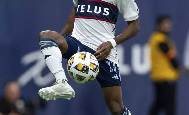 Vancouver Whitecaps' Fafa Picault kicks the ball during the first half of an MLS soccer match against the San Jose Earthquakes in Vancouver, British Columbia, Saturday, Sept. 14, 2024. (Ethan Cairns/The Canadian Press via AP)