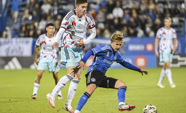 Chicago Fire's Brian Gutierrez, front left, challenges CF Montreal's Bryce Duke, front right, during second-half MLS soccer match action in Montreal, Saturday, Sept. 21, 2024. (Graham Hughes/The Canadian Press via AP)