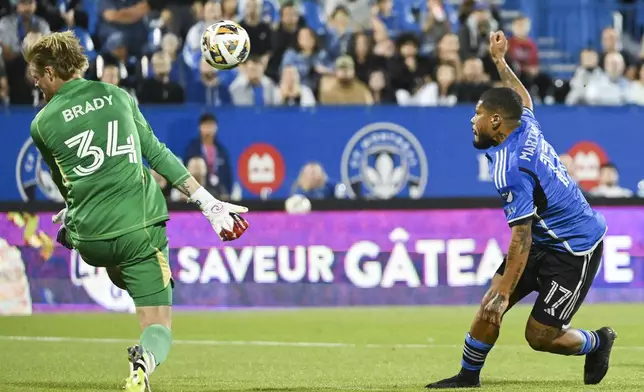 CF Montreal forward Josef Martinez (17) scores against Chicago Fire goalkeeper Chris Brady (34) during first-half MLS soccer match action in Montreal, Saturday, Sept. 21, 2024. (Graham Hughes/The Canadian Press via AP)