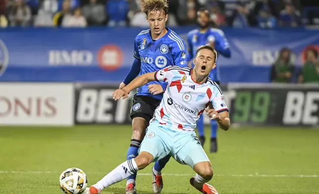 CF Montreal's Bryce Duke, left, challenges Chicago Fire's Arnaud Souquet, right, during first-half MLS soccer match action in Montreal, Saturday, Sept. 21, 2024. (Graham Hughes/The Canadian Press via AP)