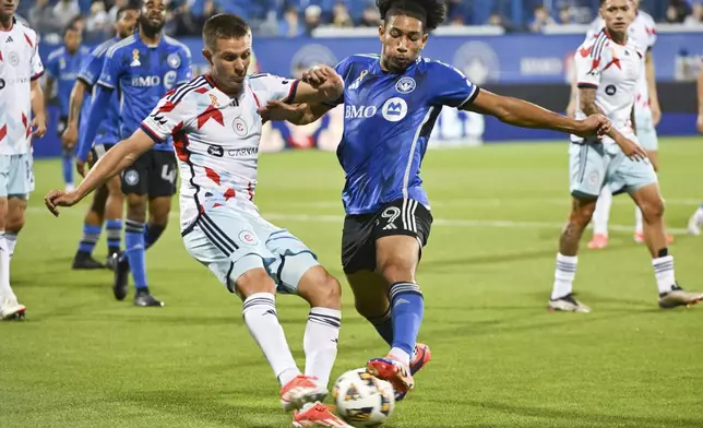 CF Montreal's Nathan-Dylan Saliba, front right, challenges Chicago Fire's Arnaud Souquet, front left, during first-half MLS soccer match action in Montreal, Saturday, Sept. 21, 2024. (Graham Hughes/The Canadian Press via AP)