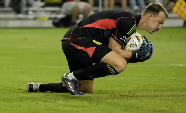 Nashville SC goalkeeper Joe Willis defends the goal during the first half of an MLS soccer match against the Chicago Fire, Wednesday, Sept. 18, 2024, in Nashville, Tenn. (AP Photo/George Walker IV)