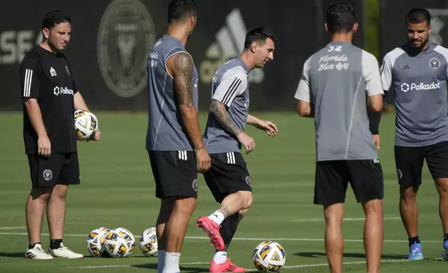 Inter Miami forward Lionel Messi, center, works out with teammates at the MLS soccer team's training facility, Friday, Sept. 13, 2024, in Fort Lauderdale, Fla. (AP Photo/Wilfredo Lee)