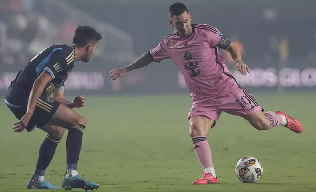 Inter Miami forward Lionel Messi (10) kicks the ball away from Philadelphia Union midfielder Leon Flach (31) during the first half of an MLS soccer match, Saturday, Sept. 14, 2024, in Fort Lauderdale, Fla. (AP Photo/Marta Lavandier)