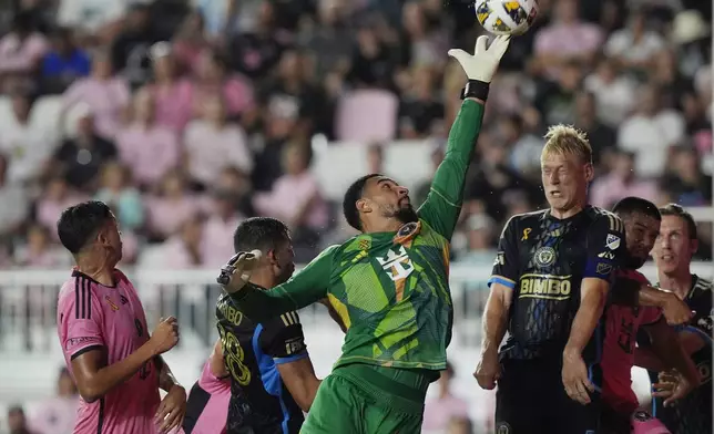 Inter Miami goalkeeper Drake Callender (1) deflects a corner kick during the first half of an MLS soccer match against the Philadelphia Union, Saturday, Sept. 14, 2024, in Fort Lauderdale, Fla. (AP Photo/Marta Lavandier)