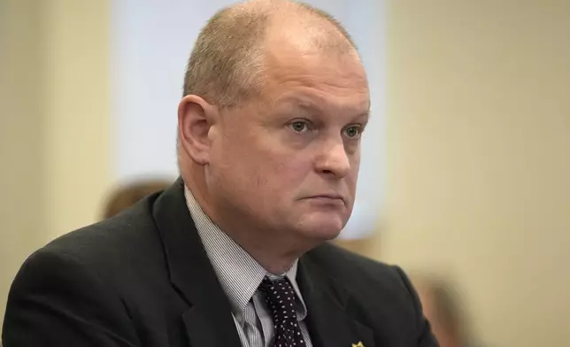 FILE - Sgt. Aaron Skolfield listens to questioning, Thursday, Jan. 25, 2024, in Augusta, Maine, during a hearing of the independent commission investigating the law enforcement response to the mass shooting in Lewiston, Maine. (AP Photo/Robert F. Bukaty, File)