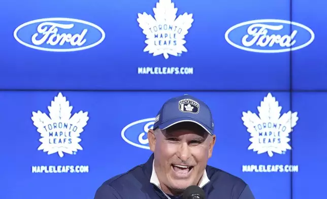 Toronto Maple Leafs new head coach Craig Berube speaks to the media during a press conference at the start of the NHL hockey team's training camp in Toronto, Wednesday, Sept. 18, 2024. (Nathan Denette/The Canadian Press via AP)