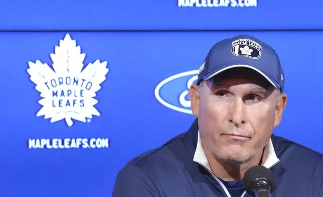 Toronto Maple Leafs new head coach Craig Berube speaks to the media during a press conference at the start of the NHL hockey team's training camp in Toronto, Wednesday, Sept. 18, 2024. (Nathan Denette/The Canadian Press via AP)