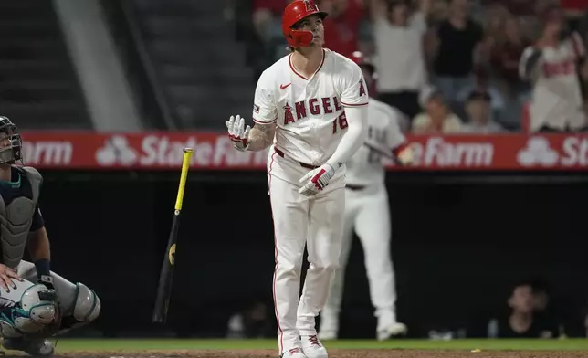 Los Angeles Angels' Mickey Moniak (16) drops his bat after hitting a walk-off home run during the ninth inning of a baseball game against the Seattle Mariners in Anaheim, Calif., Saturday, Aug. 31, 2024. The Angels won 5-4. (AP Photo/Ashley Landis)