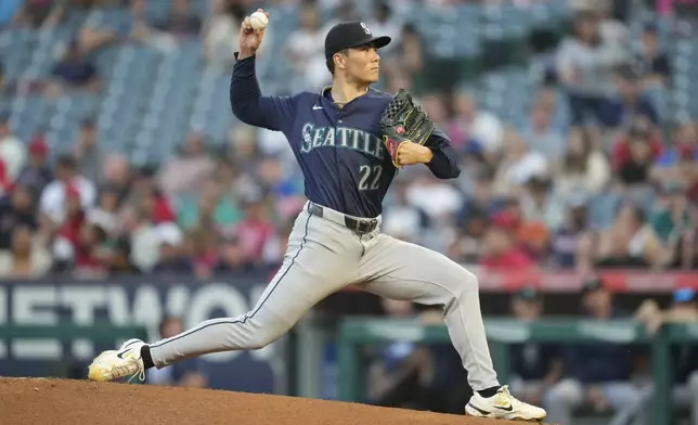 Seattle Mariners starting pitcher Bryan Woo (22) throws during the first inning of a baseball game against the Los Angeles Angels in Anaheim, Calif., Saturday, Aug. 31, 2024. (AP Photo/Ashley Landis)