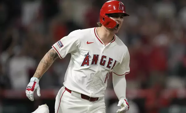 Los Angeles Angels' Mickey Moniak (16) reacts after hitting a walk-off home run during the ninth inning of a baseball game against the Seattle Mariners in Anaheim, Calif., Saturday, Aug. 31, 2024. The Angels won 5-4. (AP Photo/Ashley Landis)