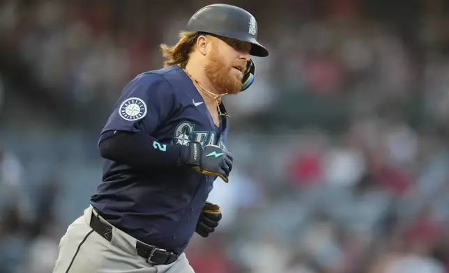 Seattle Mariners' Justin Turner runs the bases after hitting a home run during the second inning of a baseball game against the Los Angeles Angels in Anaheim, Calif., Saturday, Aug. 31, 2024. (AP Photo/Ashley Landis)