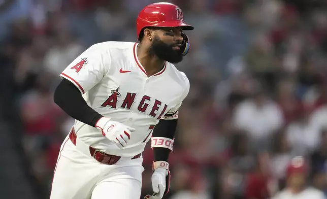 Los Angeles Angels' Jo Adell runs the bases after hitting a home run during the third inning of a baseball game against the Seattle Mariners in Anaheim, Calif., Saturday, Aug. 31, 2024. (AP Photo/Ashley Landis)