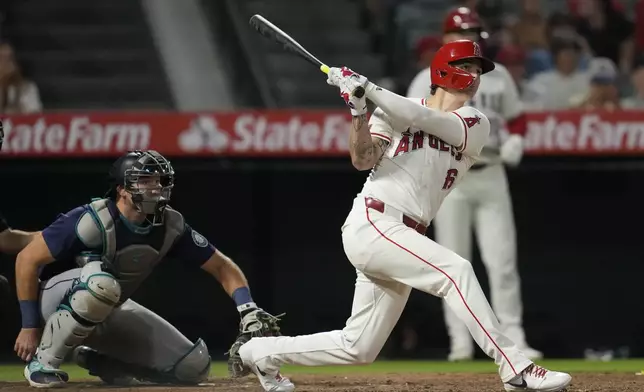 Los Angeles Angels' Mickey Moniak (16) hits a walk-off home run during the ninth inning of a baseball game against the Seattle Mariners in Anaheim, Calif., Saturday, Aug. 31, 2024. The Angels won 5-4. (AP Photo/Ashley Landis)