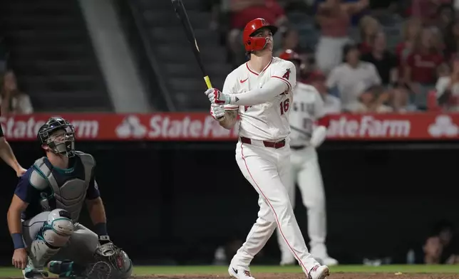 Los Angeles Angels' Mickey Moniak (16) hits a walk-off home run during the ninth inning of a baseball game against the Seattle Mariners in Anaheim, Calif., Saturday, Aug. 31, 2024. The Angels won 5-4. (AP Photo/Ashley Landis)