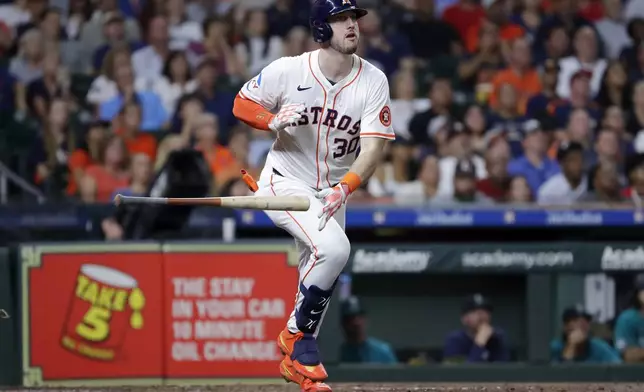 Houston Astros' Kyle Tucker flips his bat as he watches his solo home run during the fourth inning of a baseball game against the Seattle Mariners, Tuesday, Sept. 24, 2024, in Houston. (AP Photo/Michael Wyke)