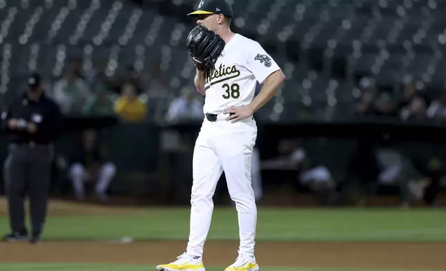 Oakland Athletics pitcher JP Sears (38) pauses on the mound during the fourth inning of a baseball game against the Seattle Mariners in Oakland, Calif., Wednesday, Sept. 4, 2024. (AP Photo/Jed Jacobsohn)