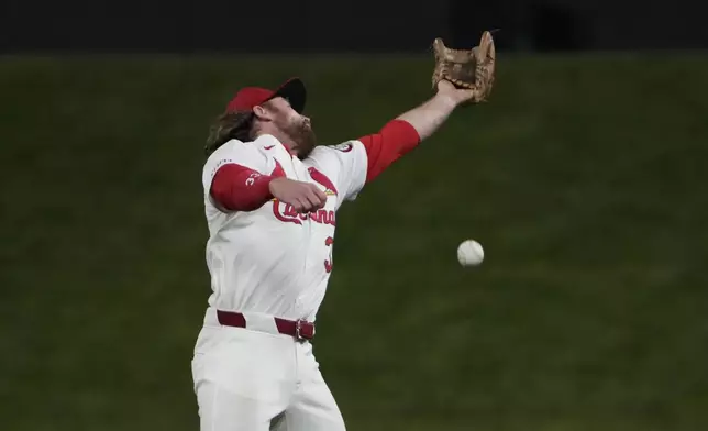 St. Louis Cardinals second baseman Brendan Donovan is unable to catch a single by Seattle Mariners' Julio Rodriguez during the ninth inning of a baseball game Friday, Sept. 6, 2024, in St. Louis. (AP Photo/Jeff Roberson)