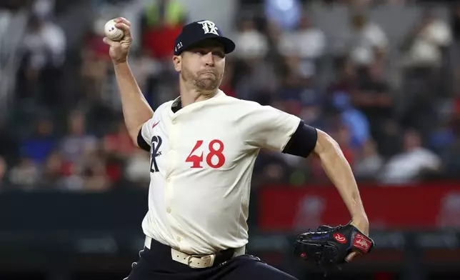 Texas Rangers starting pitcher Jacob deGrom (48) delivers in the first inning of a baseball game against the Seattle Mariners, Friday, Sept. 20, 2024, in Arlington, Texas. (AP Photo/Richard W. Rodriguez)