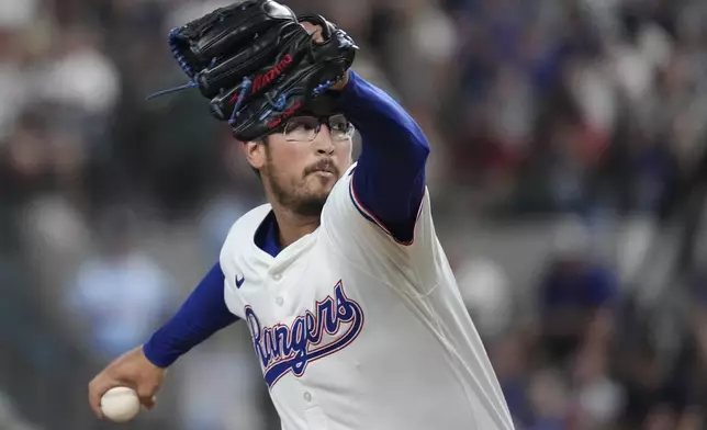 Texas Rangers starting pitcher Dane Dunning throws during the first inning of a baseball game against the Seattle Mariners, Saturday, Sept. 21, 2024, in Arlington, Texas. (AP Photo/LM Otero)