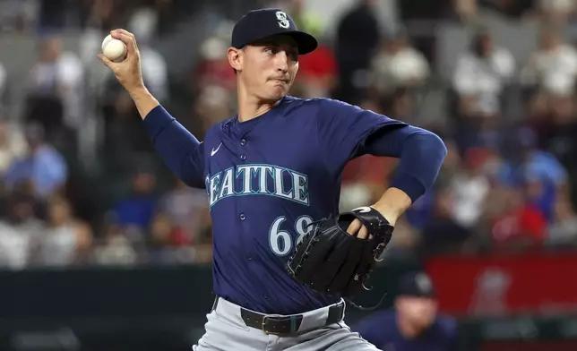 Seattle Mariners starting pitcher George Kirby (68) delivers in the first inning of a baseball game against the Texas Rangers, Friday, Sept. 20, 2024, in Arlington, Texas. (AP Photo/Richard W. Rodriguez)