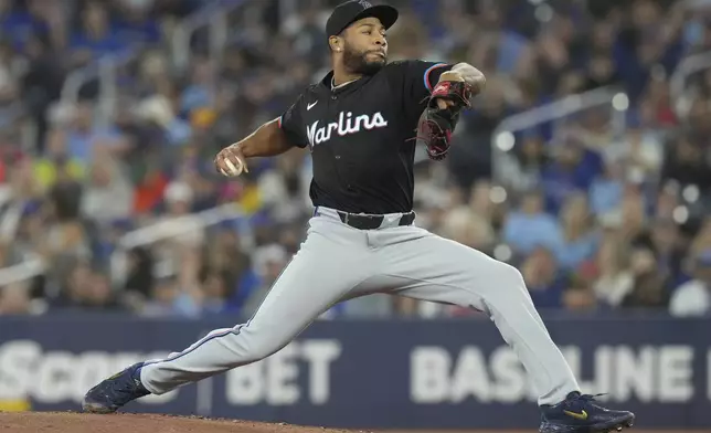 Miami Marlins pitcher Xzavion Curry works against the Toronto Blue Jays during first-inning baseball game action in Toronto, Saturday, Sept. 28, 2024. (Chris Young/The Canadian Press via AP)