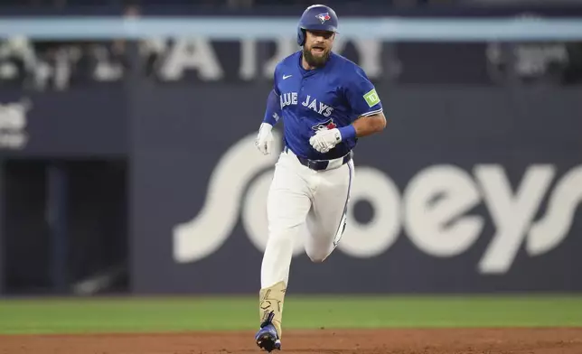 Toronto Blue Jays' Nathan Lukes rounds the bases after hitting a home run off Miami Marlins pitcher Xzavion Curry during first-inning baseball game action in Toronto, Saturday, Sept. 28, 2024. (Chris Young/The Canadian Press via AP)