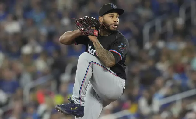 Miami Marlins pitcher Xzavion Curry works against the Toronto Blue Jays during first-inning baseball game action in Toronto, Saturday, Sept. 28, 2024. (Chris Young/The Canadian Press via AP)