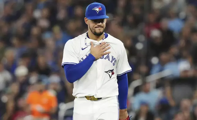 Toronto Blue Jays pitcher Jose Berrios walks back to the dugout during third-inning baseball game action against the Miami Marlins in Toronto, Friday, Sept. 27, 2024. (Chris Young/The Canadian Press via AP)