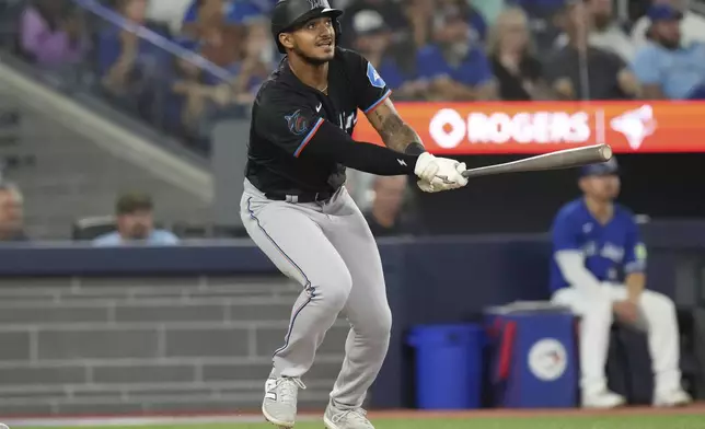 Miami Marlins' Dane Myers watches his two-run double during sixth-inning baseball game action against the Miami Marlins in Toronto, Saturday, Sept. 28, 2024. (Chris Young/The Canadian Press via AP)