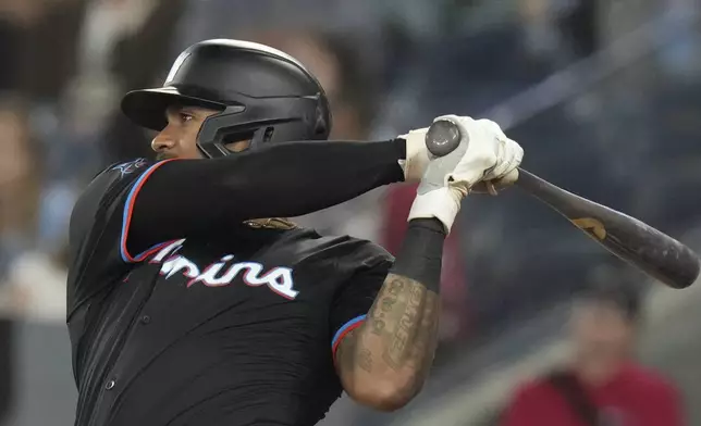 Miami Marlins' Dane Myers hits a three-run home run during the eighth inning of a baseball game against the Toronto Blue Jays in Toronto, Saturday, Sept. 28, 2024. (Chris Young/The Canadian Press via AP)