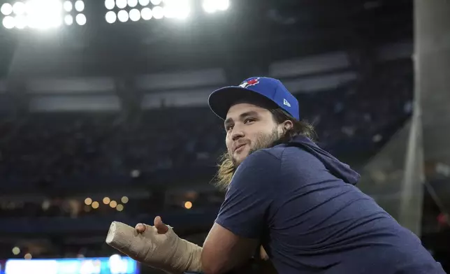 Toronto Blue Jays' Bo Bichette stands in the dugout during baseball game action against the Miami Marlins in Toronto, Saturday, Sept. 28, 2024. (Chris Young/The Canadian Press via AP)