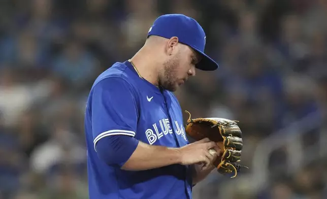 Toronto Blue Jays pitcher Yariel Rodríguez reacts after giving up an RBI double to Miami Marlins' Griffin Conine during first-inning baseball game action in Toronto, Saturday, Sept. 28, 2024. (Chris Young/The Canadian Press via AP)