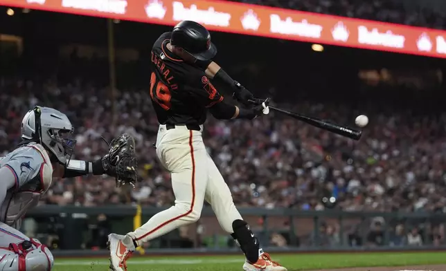 San Francisco Giants' Tyler Fitzgerald hits an RBI single during the sixth inning of a baseball game against the Miami Marlins, Saturday, Aug. 31, 2024, in San Francisco. (AP Photo/Godofredo A. Vásquez)