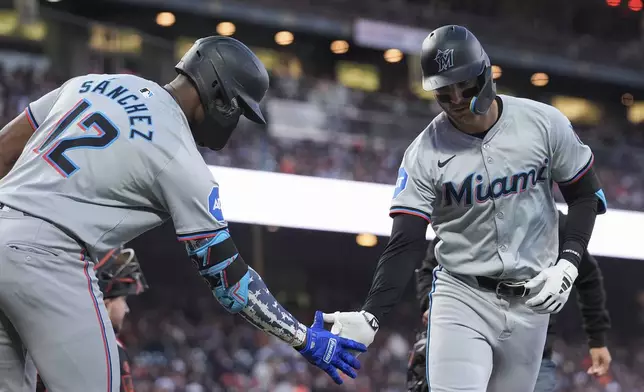 Miami Marlins' Connor Norby, right, celebrates with Jesús Sánchez after hitting a solo home run during the sixth inning of a baseball game against the San Francisco Giants, Saturday, Aug. 31, 2024, in San Francisco. (AP Photo/Godofredo A. Vásquez)