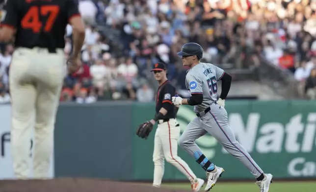 Miami Marlins' Griffin Conine, right, runs the bases after hitting a two-run home run off San Francisco Giants pitcher Mason Black (47) during the second inning of a baseball game Saturday, Aug. 31, 2024, in San Francisco. (AP Photo/Godofredo A. Vásquez)