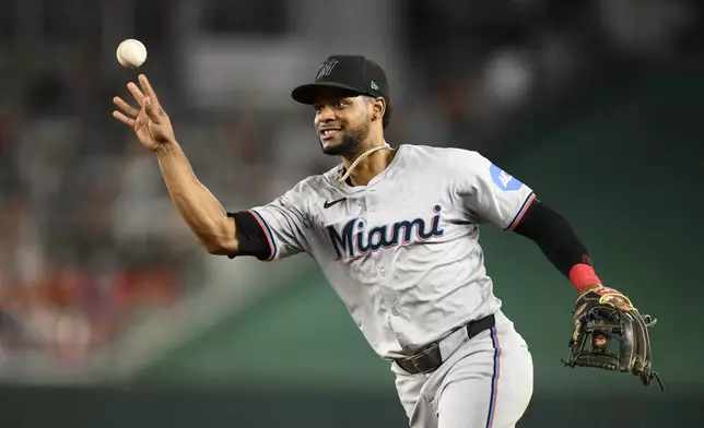 Miami Marlins second baseman Otto Lopez throws to first to put out Washington Nationals' Joey Gallo during the fourth inning of a baseball game, Friday, Sept. 13, 2024, in Washington. (AP Photo/Nick Wass)