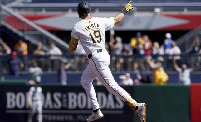 Pittsburgh Pirates' Jared Triolo rounds the bases after hitting a home run during the second inning of a baseball game against the Miami Marlins Wednesday, Sept. 11, 2024, in Pittsburgh. (AP Photo/Matt Freed)