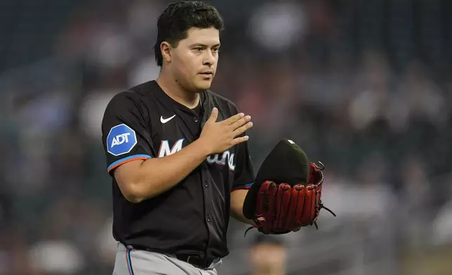 Miami Marlins pitcher Valente Bellozo walks back to the dugout after the bottom of the first inning of a baseball game against the Minnesota Twins, Thursday, Sept. 26, 2024, in Minneapolis. (AP Photo/Abbie Parr)