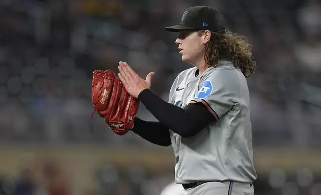 Miami Marlins starting pitcher Ryan Weathers (60) celebrates after the final out to end the bottom of the fifth inning of a baseball game against the Minnesota Twins, Tuesday, Sept. 24, 2024, in Minneapolis. (AP Photo/Abbie Parr)