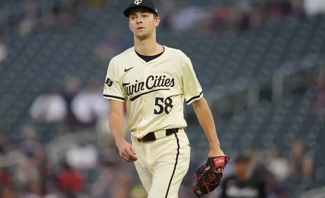 Minnesota Twins pitcher David Festa (58) stands on the mound after walking Miami Marlins' Xavier Edwards during the first inning of a baseball game Thursday, Sept. 26, 2024, in Minneapolis. (AP Photo/Abbie Parr)