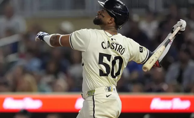 Minnesota Twins' Willi Castro (50) watches his fly out to center field during the second inning of a baseball game against the Miami Marlins, Thursday, Sept. 26, 2024, in Minneapolis. (AP Photo/Abbie Parr)