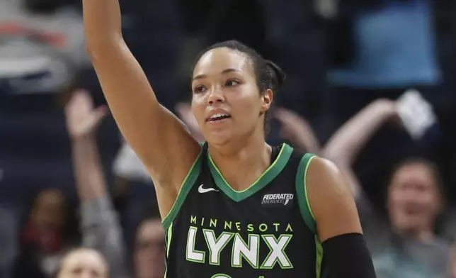 Minnesota Lynx forward Napheesa Collier celebrates her three-point basket against the Phoenix Mercury in the fourth quarter of Game 2 of a WNBA basketball first-round playoff game Wednesday, Sept. 25, 2024, in Minneapolis. (AP Photo/Bruce Kluckhohn)