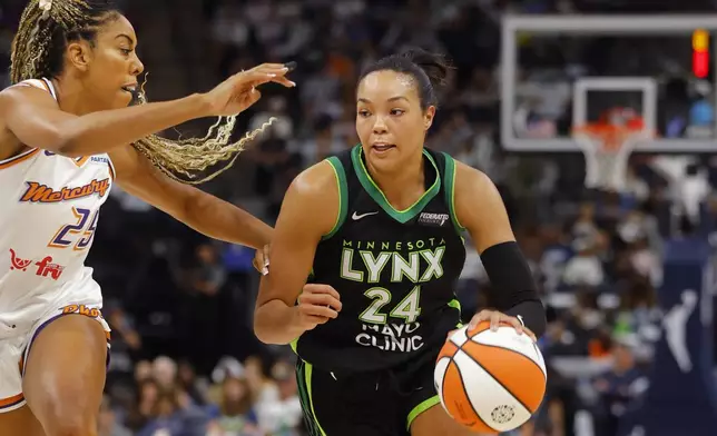 Minnesota Lynx forward Napheesa Collier (24) works around Phoenix Mercury forward Monique Billings, left, in the first quarter of Game 2 of a WNBA basketball first-round playoff game Wednesday, Sept. 25, 2024, in Minneapolis. (AP Photo/Bruce Kluckhohn)