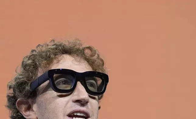 Mark Zuckerberg wears a pair of Orion AR glasses during the Meta Connect conference Wednesday, Sept. 25, 2024, in Menlo Park, Calif. (AP Photo/Godofredo A. Vásquez)