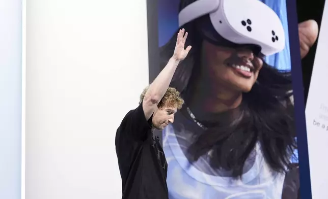 Mark Zuckerberg waves to the crowd as he exits the stage at the Meta Connect conference Wednesday, Sept. 25, 2024, in Menlo Park, Calif. (AP Photo/Godofredo A. Vásquez)